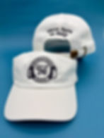 white dad hat with international school logo