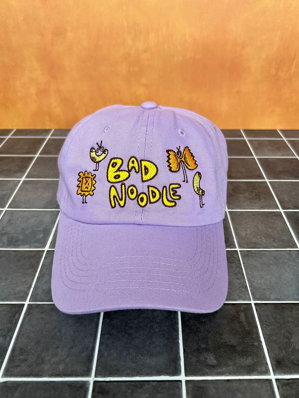 Thumbnail: Purple embroidered bad noodle baseball hat