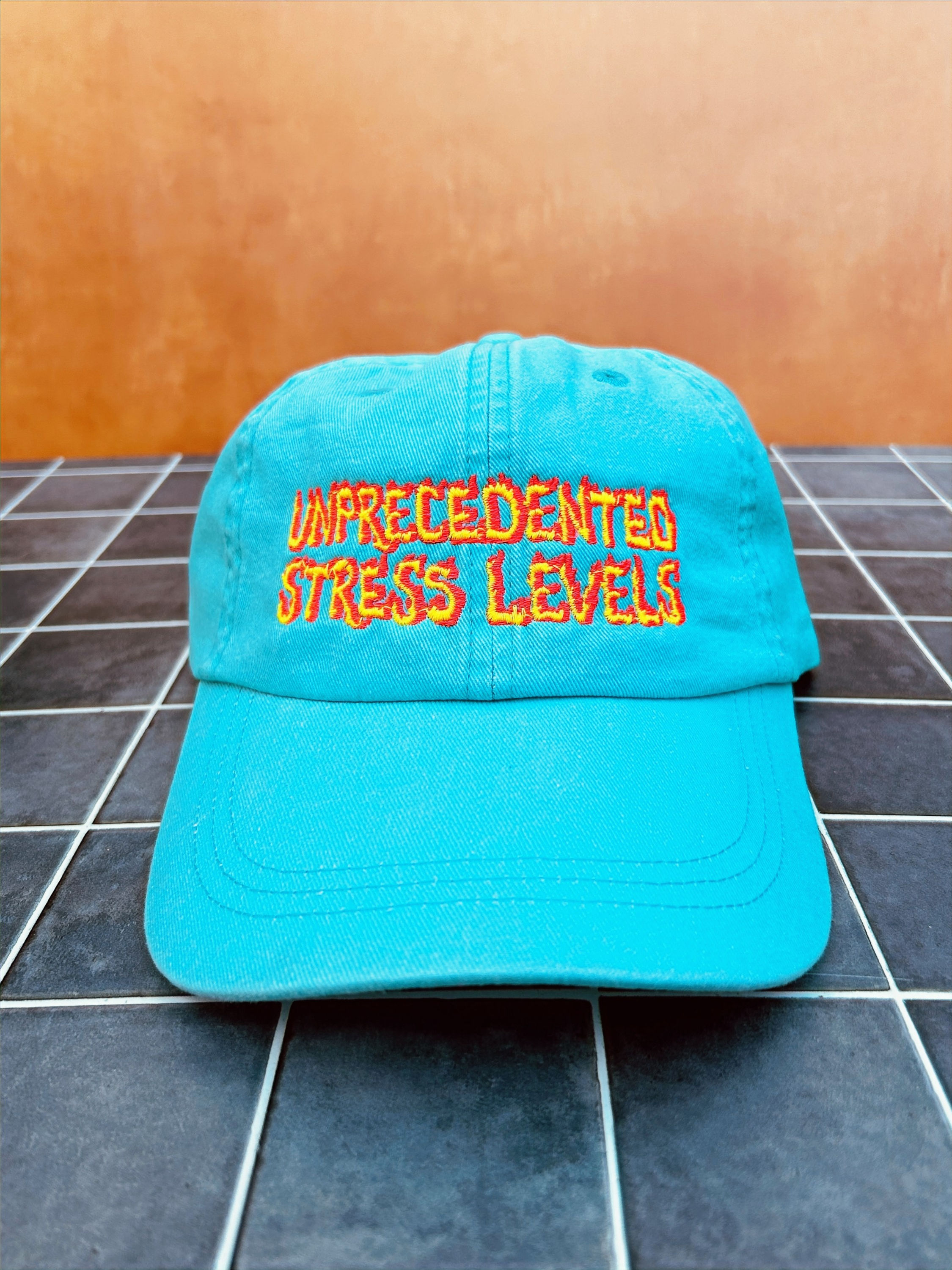 Aqua blue baseball hat with flaming letter embroidery