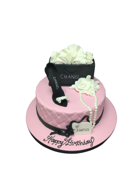 Luxurious Chanel-themed cake for fashion lovers, adorned with elegant black and white design elements, perfect for special occasions.