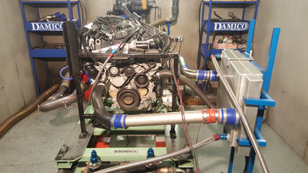 Engine testing bench with Damico Engines Ltd, showing its intricate inner workings.