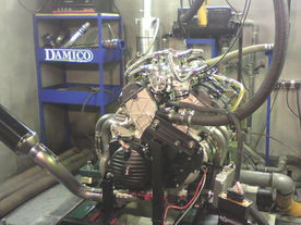 Engine on dyno with Damico exhaust manifold and tubing