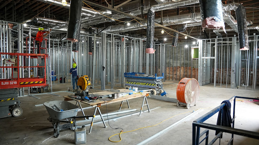 JL Construction team working on framing a commercial office project.