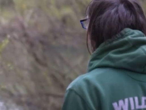 a male in a wildlife rescuer hoodie 