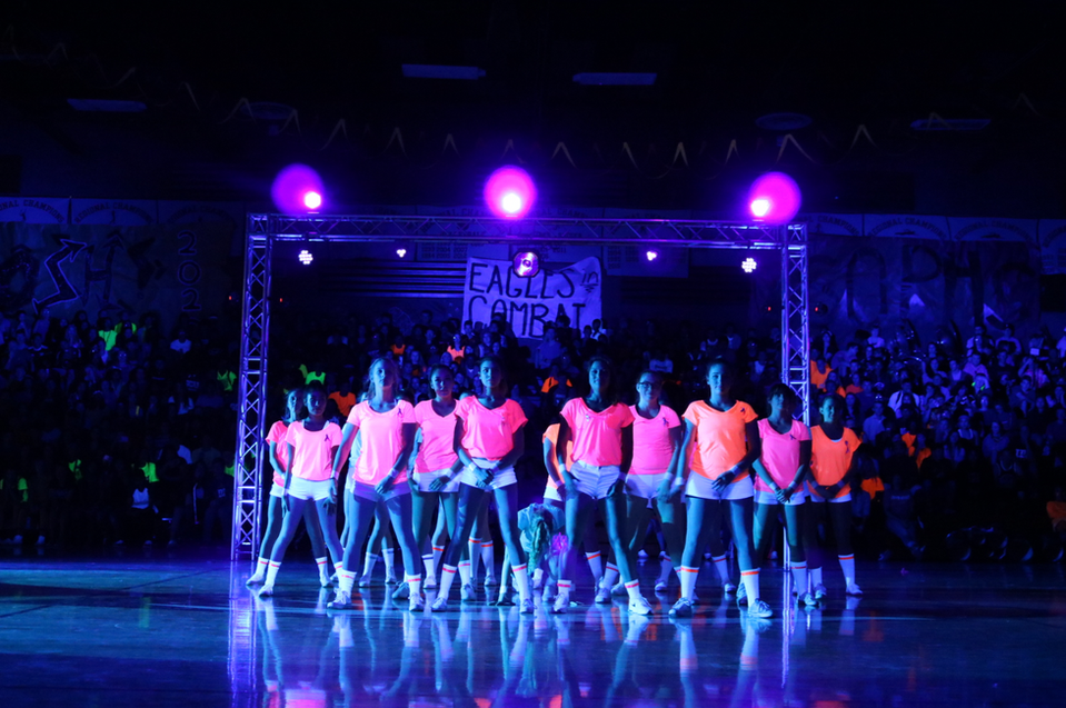 Blacklight high school assembly with lighting and sound with truss and effects