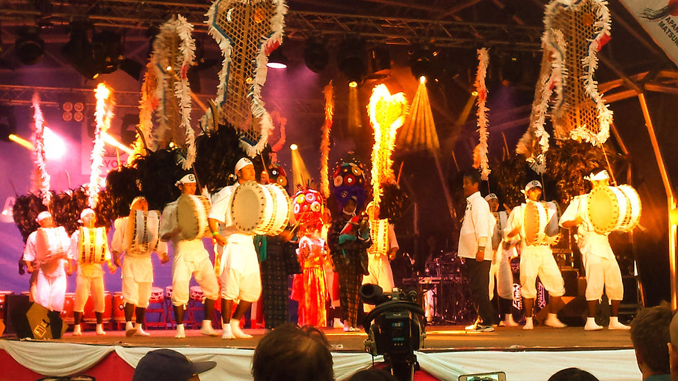 Costumed musicians and drummers performing on stage at Boulevard World in Riyadh.