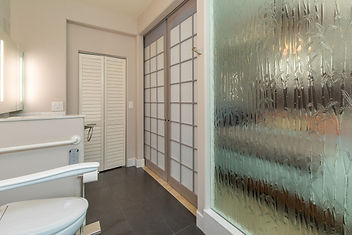 Use of etched glass wall to increase space
