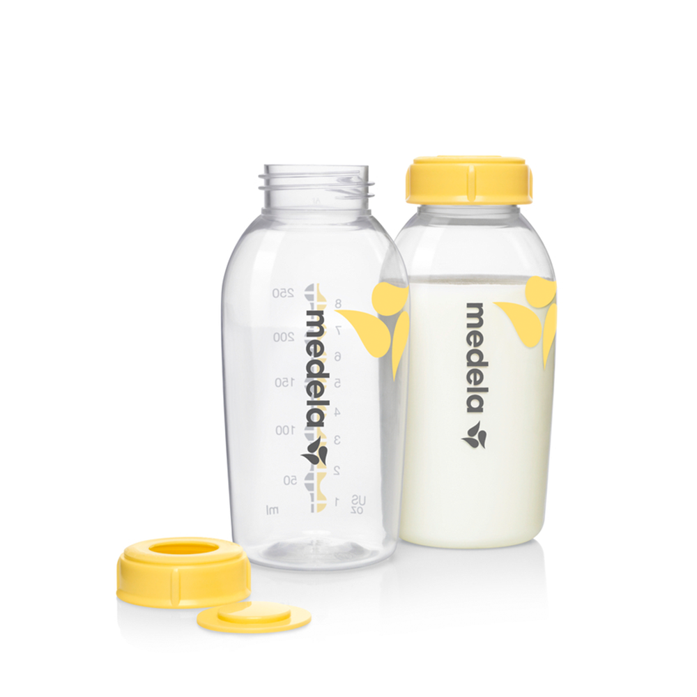 Medela breast milk bottles with yellow caps