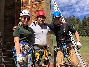 Two staff and a camper at Koertner Climbing Tower. Date 2022