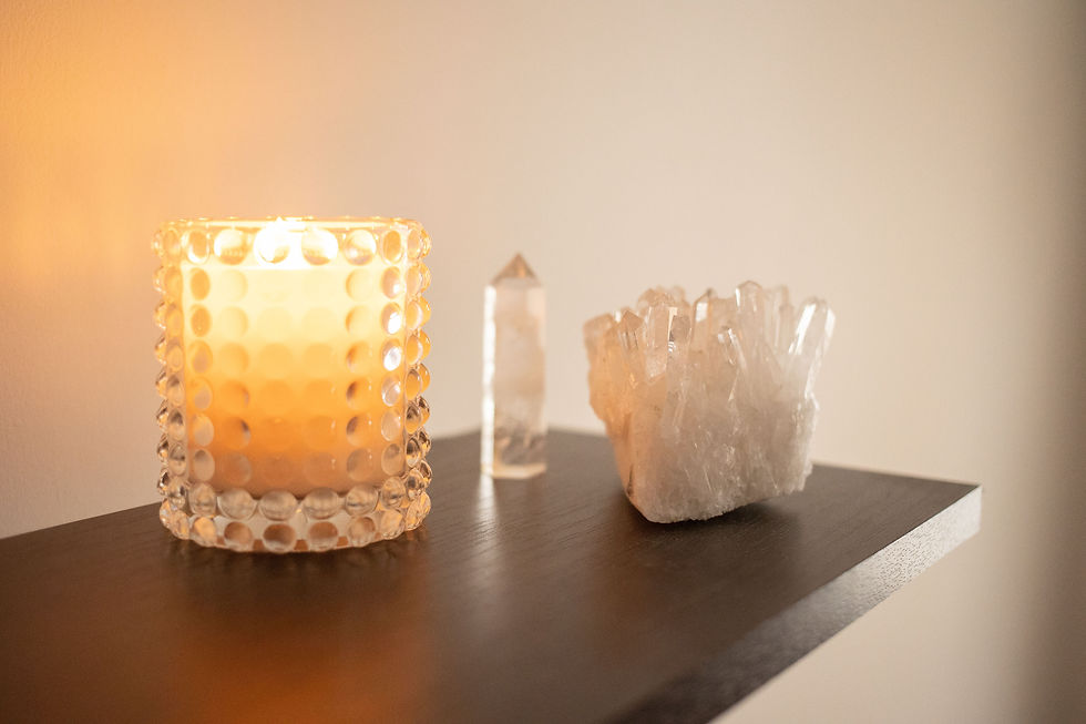 Eye-level view of a serene meditation space with candles and crystals