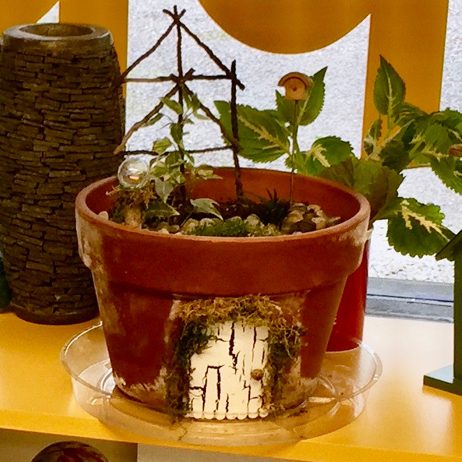Clay pot fairy garden with fairy door