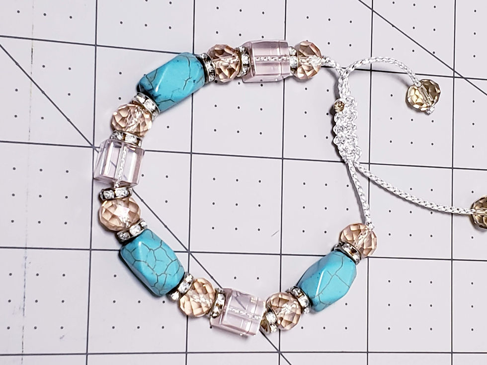 Adjustable beaded bracelet with turquoise and gold beads