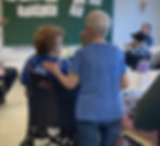 Members participating in a group activity in a classroom