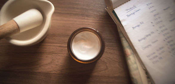 aru on table with notepad and pestle