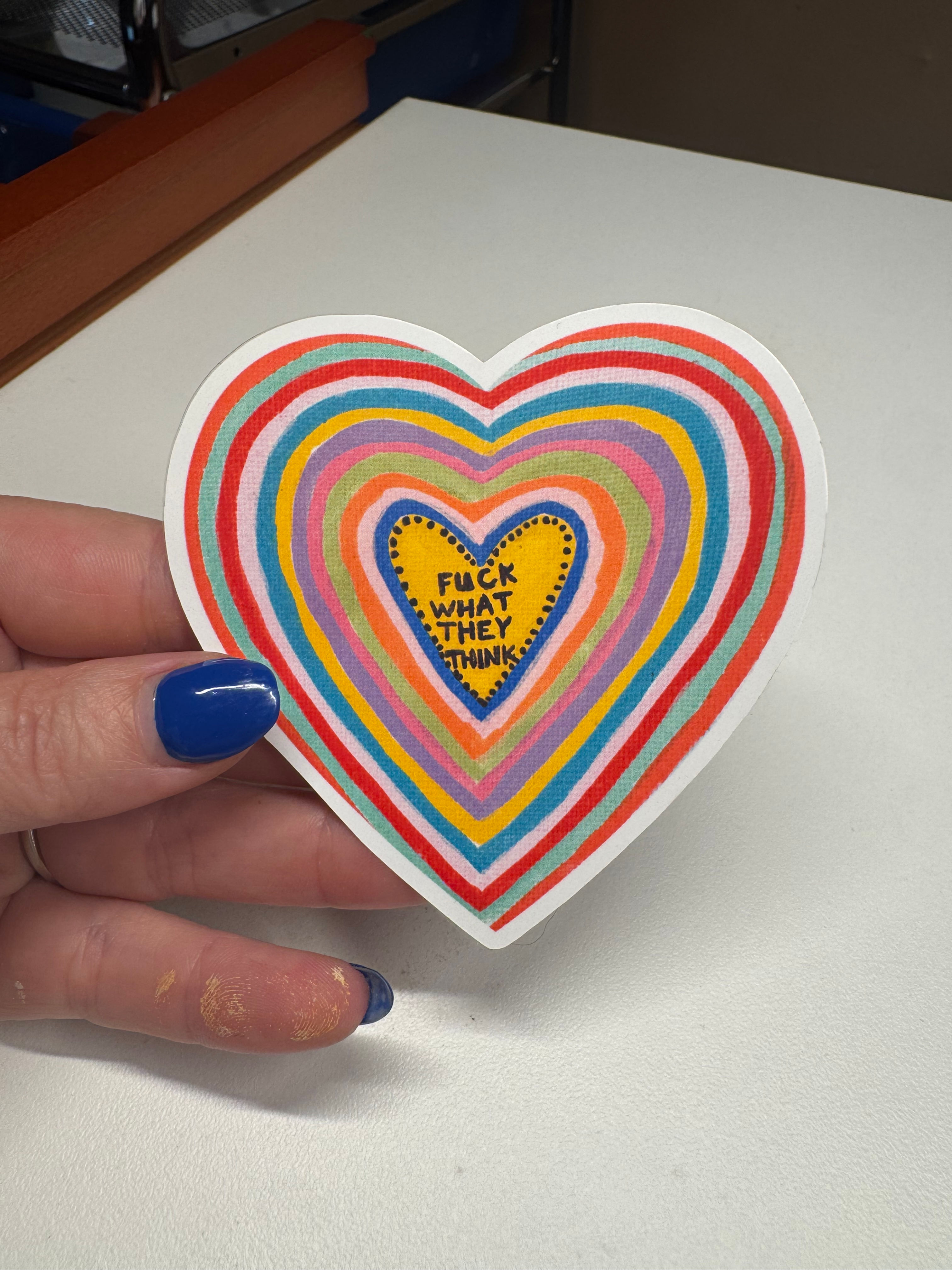 bright rainbow stripes with the words fuck what they think on a sticker made by Kat's Creative