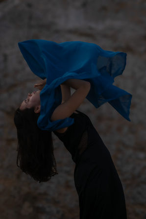 Artistic movement photograph with flowing blue fabric