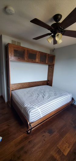 Oak murphy bed with shelving unit