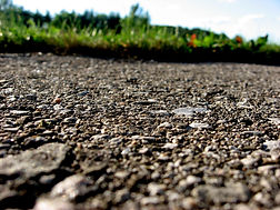 Closeup_of_pavement_with_grass.jpeg