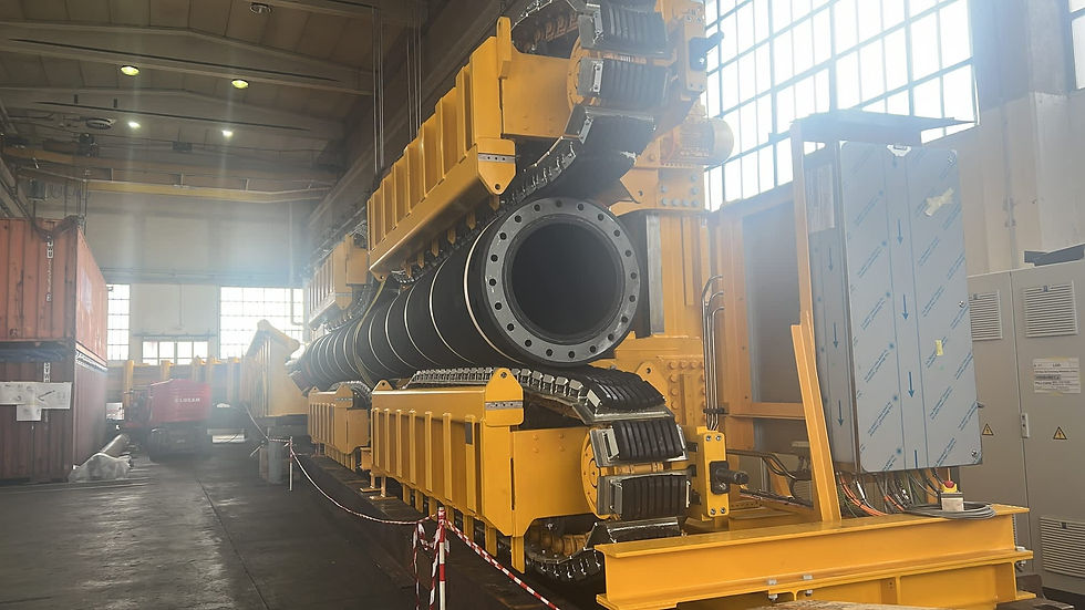 Heavy industrial hydraulic machinery in a factory setting.