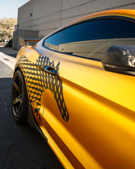 Gold Ford Mustang with custom horse graphic wrap in Temecula, CA