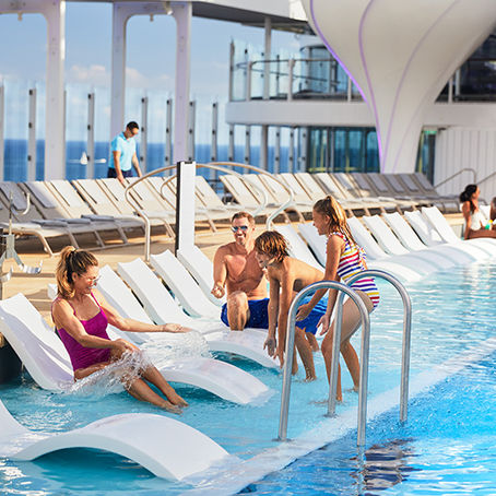 Family enjoying resort deck on Celebrity Edge