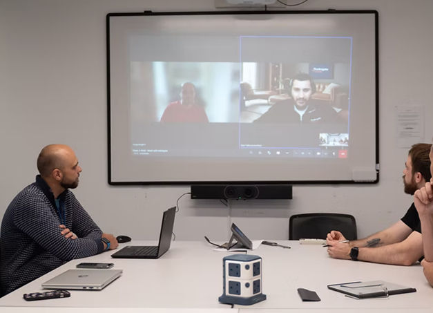 Close-up view of a server room with racks of network equipment and blinking lights