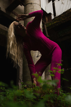 Model in pink jumpsuit in abandoned Oregon facility
