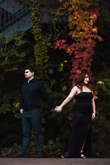 Dark and brooding couple in front of Autumn vines at McMenamins wedding venue
