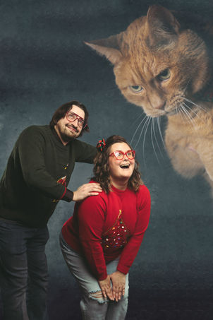 awkward 80s themed portraits in Portland floating cat over couple 