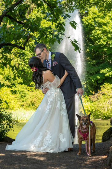 Bride and Groom Kiss below fountain