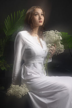 Evy senior student in vintage white ethereal floral and foliage