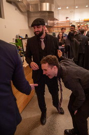 Excited guests dance at a wedding reception