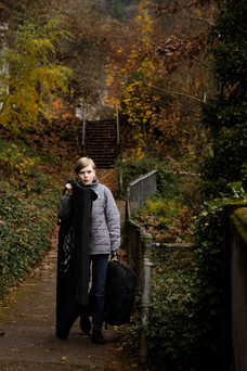 Young boy on Portland street assisting professional photographer