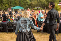 Alternative wedding couple with black wedding dress and black suit at oregon farmhouse