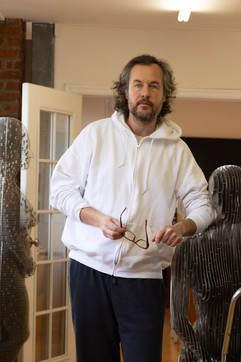 Candid creators in metal sculpting art studio of portland