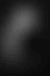 Beautiful woman in black in studio for professional corporate headshots