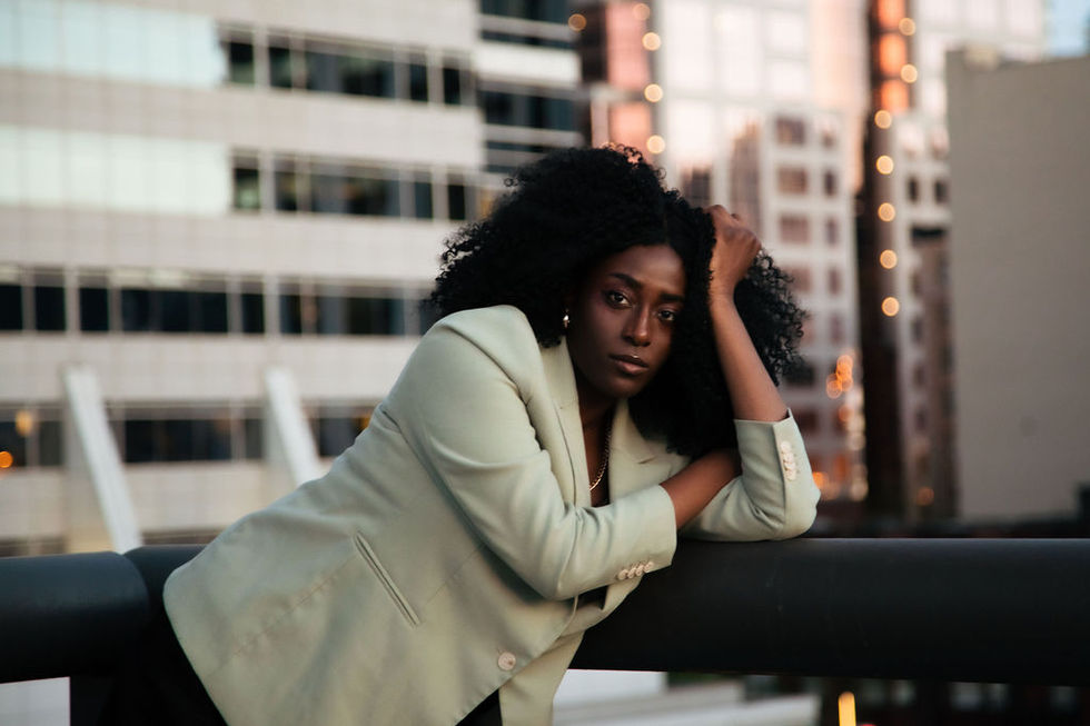 female model in front of Portland skyscraper in business attire at Portland Shooter event