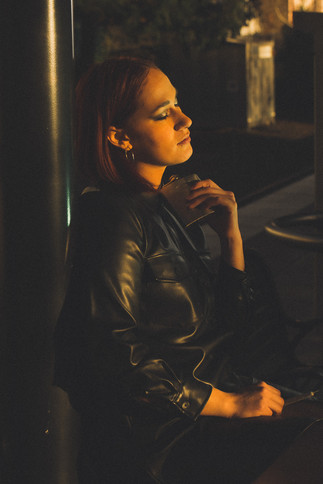 grungy smoking model on a train platform in Portland with creative professional lighting
