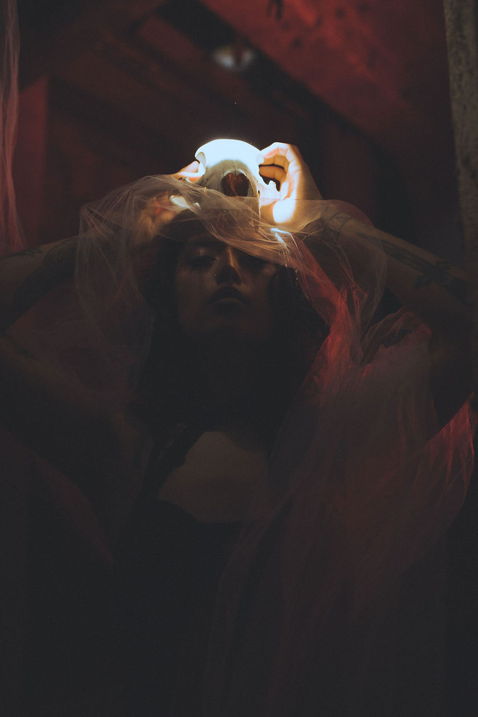 Whimsical fine art portraits of female model in low key abandoned facility