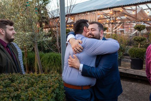 Groom welcomes wedding guests