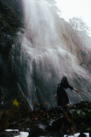Woman in front of Wahclella waterfall PNW Rose Gerber