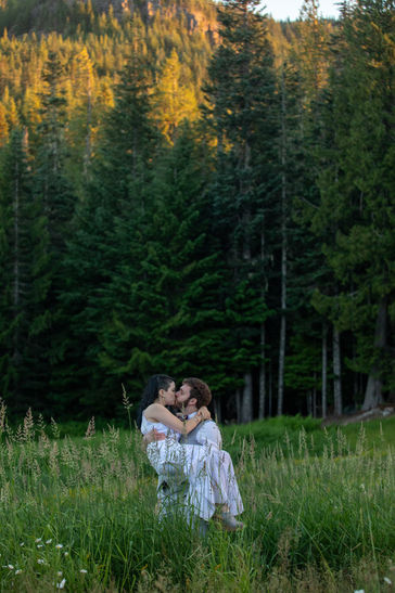Wedding Couple in tall grass near Mount Hood as seen by elopement photographer
