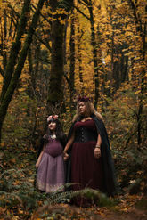 Mother and daughter in fantasy fairy attire in Oregon fall leaves
