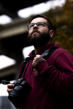 Well and natural lit professional photographer with camera in urban residentialPortland