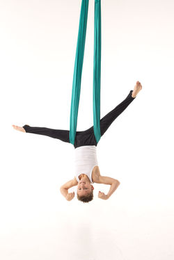 Aerial dancers artists on white cyclorama