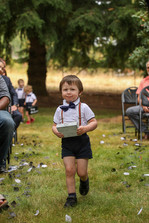 Alternative wedding couple with black wedding dress and black suit at oregon farmhouse