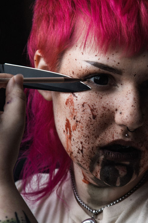 Portland SFX KatieFX studio branding with makeup tools and pink hair