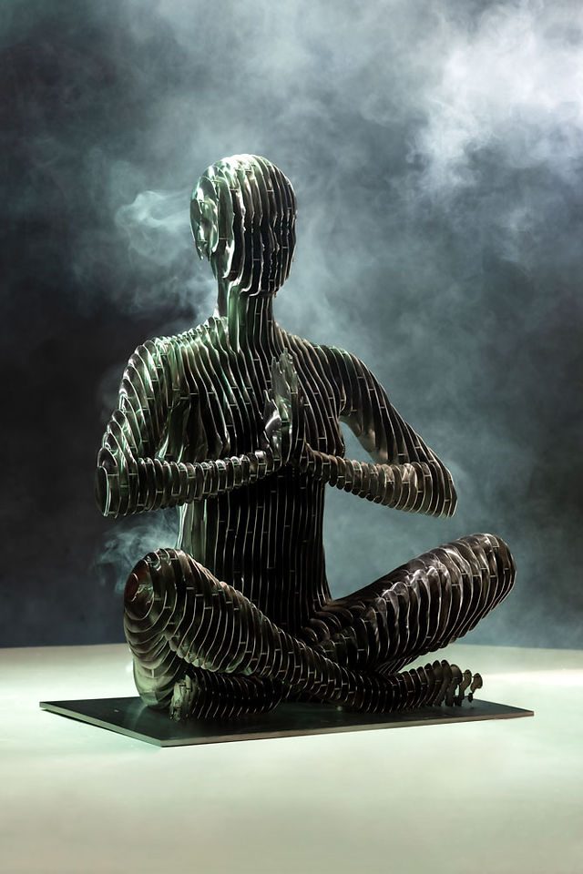 Expertly lit fine-art sculpture in professional photo studio smoke and colors