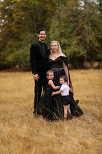 Alternative wedding couple with black wedding dress and black suit at oregon farmhouse