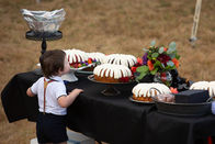 Alternative wedding couple with black wedding dress and black suit at oregon farmhouse